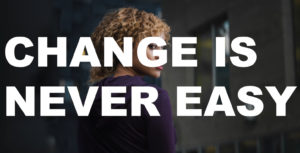 Image of a girl from behind with the text "Change is never easy" over it