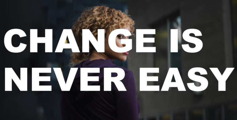 Image of a girl from behind with the text "Change is never easy" over it