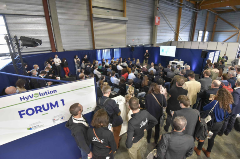 Audience watching presentation at fair