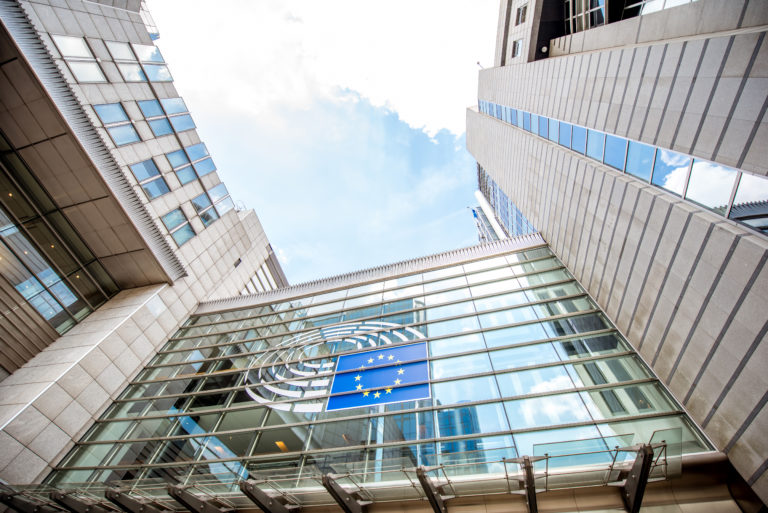 View of the European parliament building in Brussels seen from below with skies above